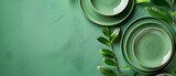 Green plates arrangement on green background 