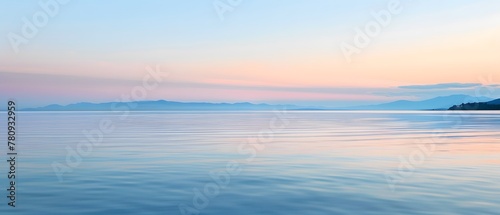 Seascape with pastel twilight colors and serene water reflections.