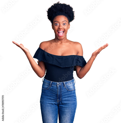 Young african american woman wearing casual clothes celebrating victory with happy smile and winner expression with raised hands
