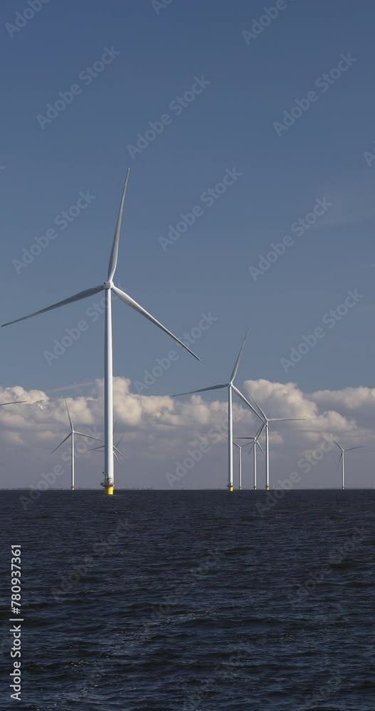 Windturbines in the water producing alternative green energy. Windturbines in the water producing alternative green energy.