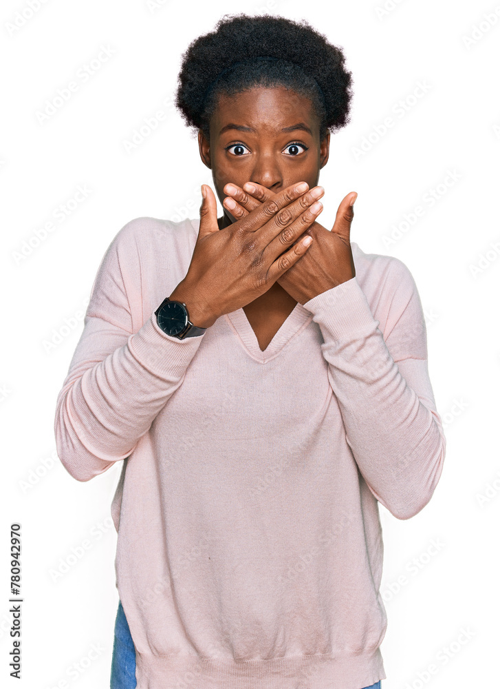 Young african american girl wearing casual clothes shocked covering mouth with hands for mistake. secret concept.