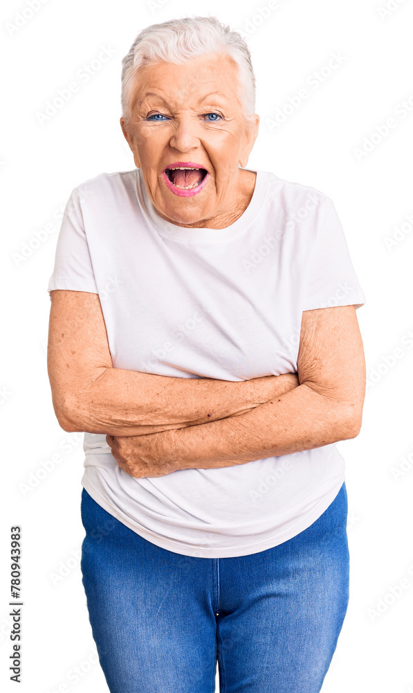 Senior beautiful woman with blue eyes and grey hair wearing casual white tshirt smiling and laughing hard out loud because funny crazy joke with hands on body. Senior beautiful woman with blue eyes and grey hair wearing casual white tshirt smiling and laughing hard out loud because funny crazy joke with hands on body.