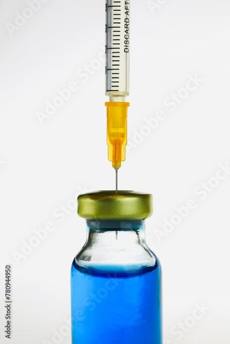 Vial and syringe with covid-19 vaccine on the white a background