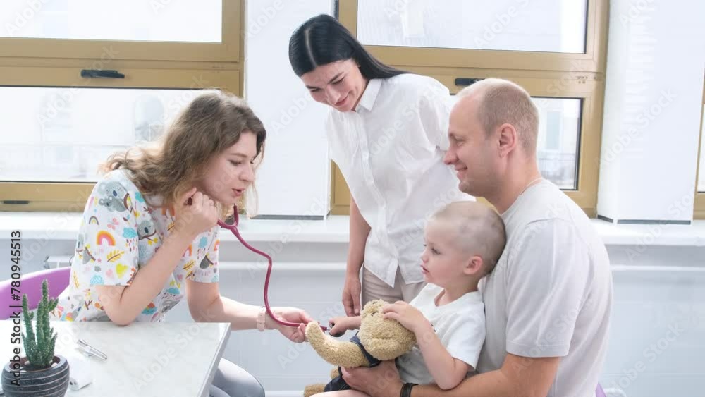 Pediatrician Examining Young Boy With Stethoscope in Clinic During Daytime Pediatrician Examining Young Boy With Stethoscope in Clinic During Daytime