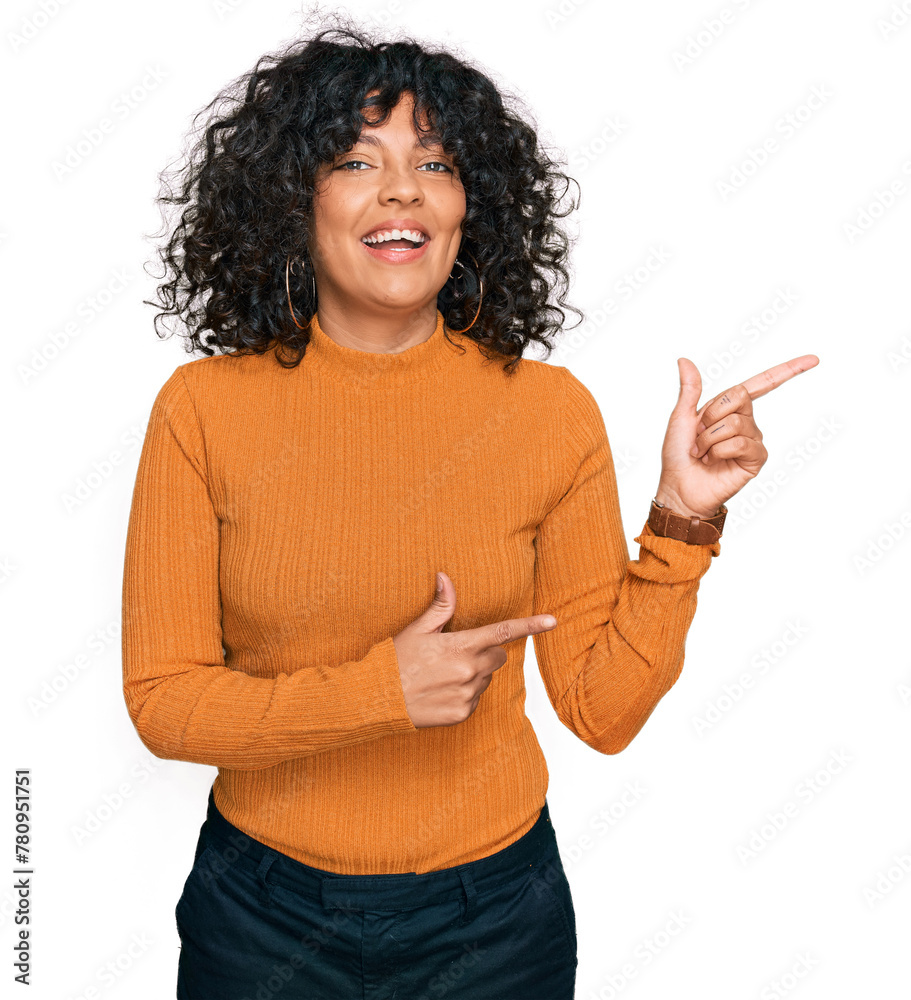 Young hispanic woman wearing casual clothes smiling and looking at the camera pointing with two hands and fingers to the side. Young hispanic woman wearing casual clothes smiling and looking at the camera pointing with two hands and fingers to the side.