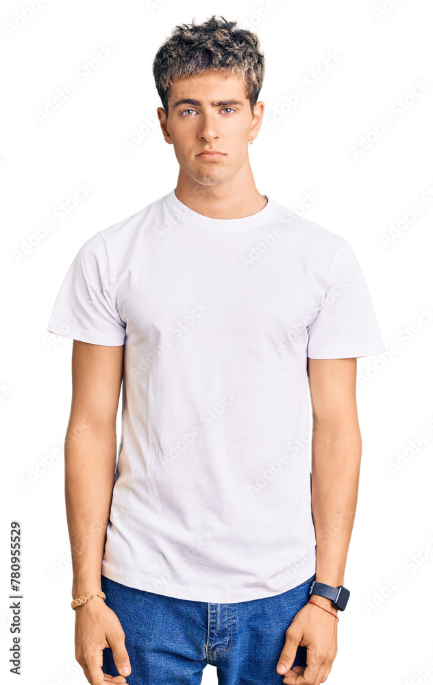 Young handsome man wearing casual white tshirt depressed and worry for distress, crying angry and afraid. sad expression. Young handsome man wearing casual white tshirt depressed and worry for distress, crying angry and afraid. sad expression.