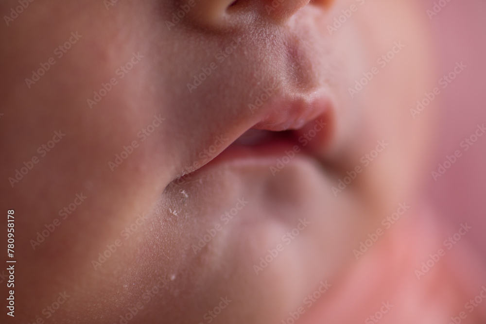 Obraz premium Newborn baby tiny little lips mouth body part