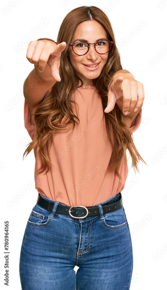 Young hispanic woman wearing casual clothes and glasses pointing to you and the camera with fingers, smiling positive and cheerful Young hispanic woman wearing casual clothes and glasses pointing to you and the camera with fingers, smiling positive and cheerful