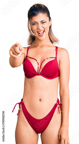 Young beautiful woman wearing bikini pointing displeased and frustrated to the camera, angry and furious with you © Krakenimages.com