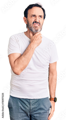 Middle age handsome man wearing casual t-shirt touching painful neck  sore throat for flu  clod and infection