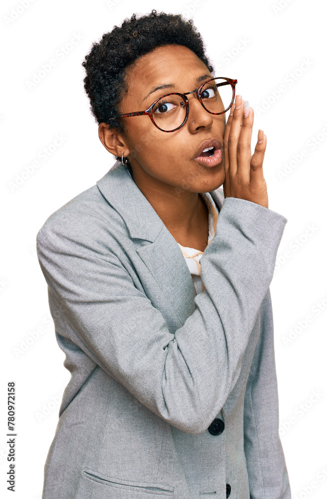 Young african american woman wearing business clothes hand on mouth telling secret rumor, whispering malicious talk conversation Young african american woman wearing business clothes hand on mouth telling secret rumor, whispering malicious talk conversation