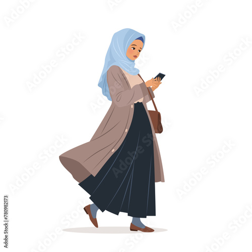 Muslim woman in hijab walking and using her smartphone. Character holding a mobile phone in her hands, surfing internet and chatting. isolated vector illustration on white background.