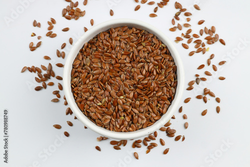 Pile of flax seeds isolated on white background