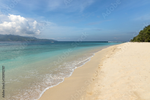 Turquoise water and pure white sand beach at the shore of famous Gili meno island in Lombok, Indonesia