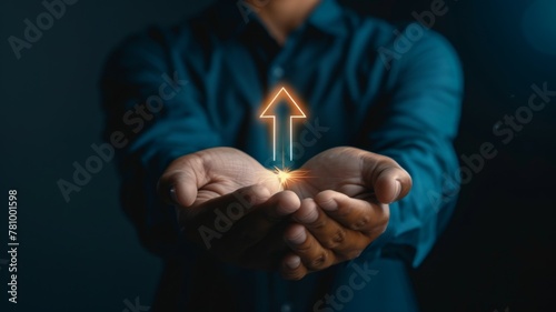 Person presenting a luminous arrow upwards - An individual with outstretched hands presents a singular bright arrow pointing upward, symbolizing direction, growth, or progress