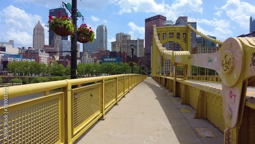 Walking over a bridge towards downtown Pittsburgh.