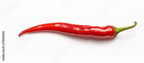 Vibrant close-up of a red hot pepper against a clean white background, showcasing its fiery hue and texture