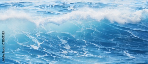 A detailed view capturing the beauty of a wave in the ocean under a clear sky background