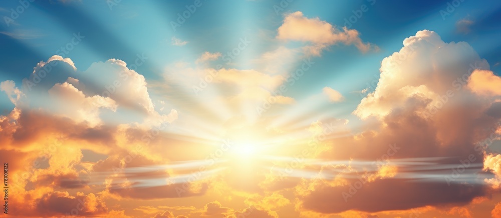 Sunlight streaming through clouds on a sandy beach landscape with a clear sky and gentle waves Sunlight streaming through clouds on a sandy beach landscape with a clear sky and gentle waves