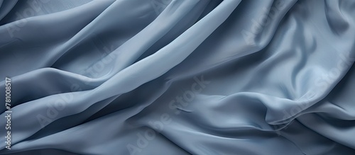 Blue fabric displaying a detailed and lengthy pattern, close-up shot