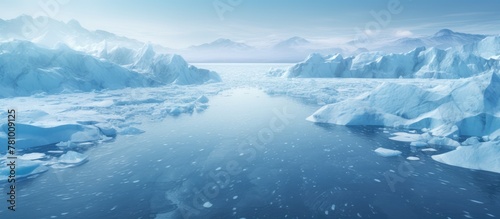 Icy body of water featuring distant floating icebergs in the background on a cold winter day