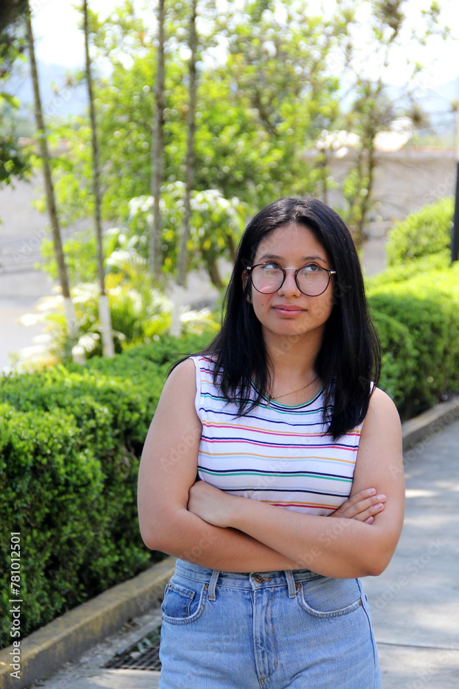 Teenage woman shows an attitude of annoyance and anger with a very irritable mood due to problems managing her emotions Teenage woman shows an attitude of annoyance and anger with a very irritable mood due to problems managing her emotions