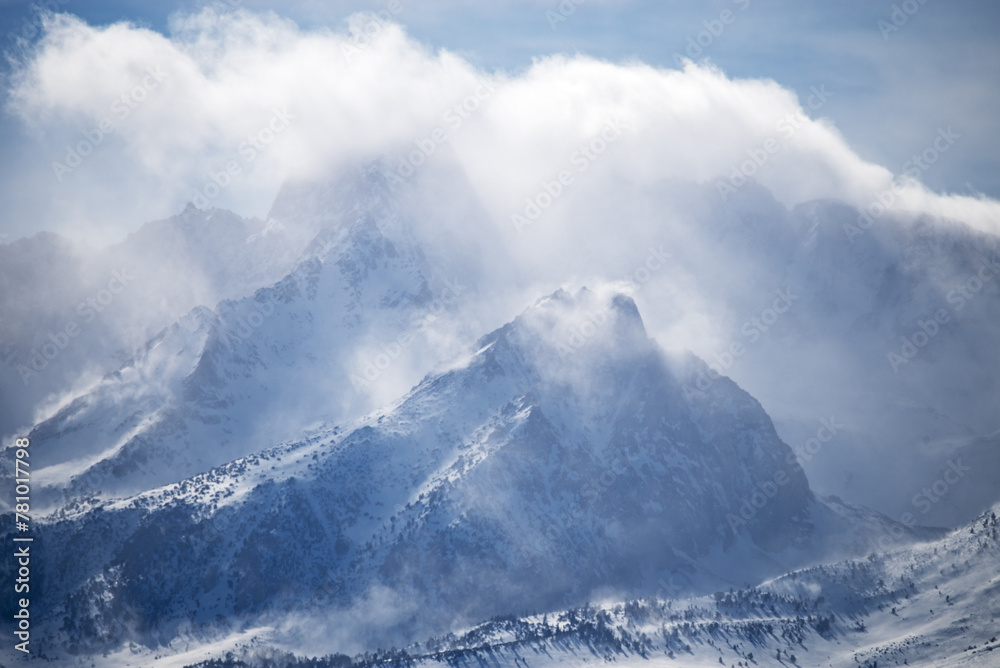 Clouds And Snow Blowing In The Mountains