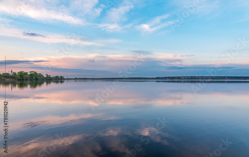Blue lake with cloudy sky, natural background © Dmitrii Potashkin