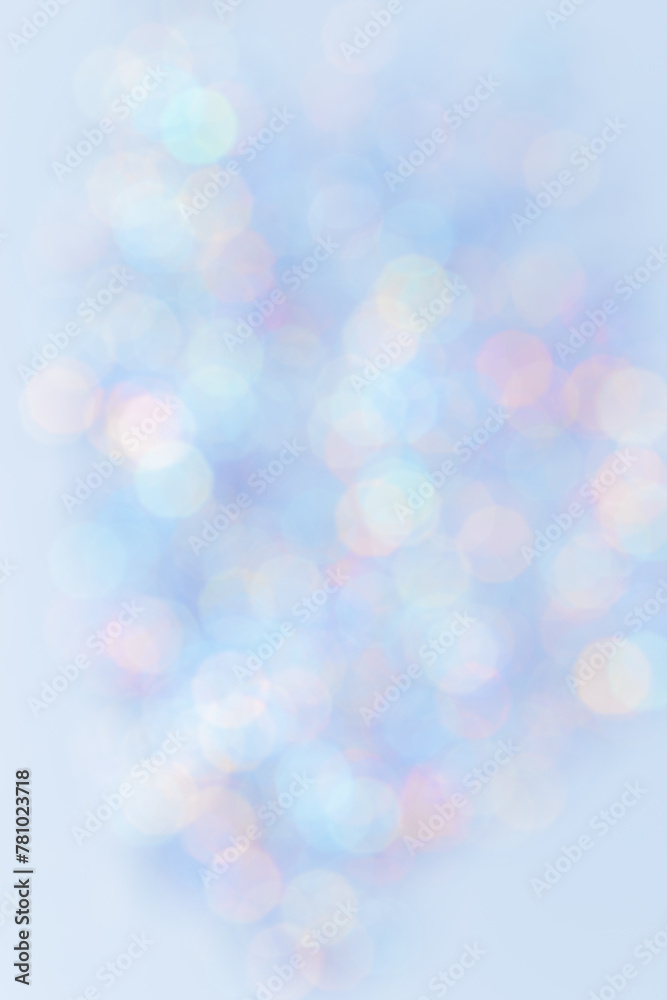 Defocused abstract blue bokeh background pastel colored, flare from lights, color gradient, blurred round bokeh as holiday texture. Glittering aesthetic textured lighting vertical pattern Defocused abstract blue bokeh background pastel colored, flare from lights, color gradient, blurred round bokeh as holiday texture. Glittering aesthetic textured lighting vertical pattern