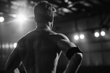 A man with no shirt standing in a gym with lights. Generative AI.