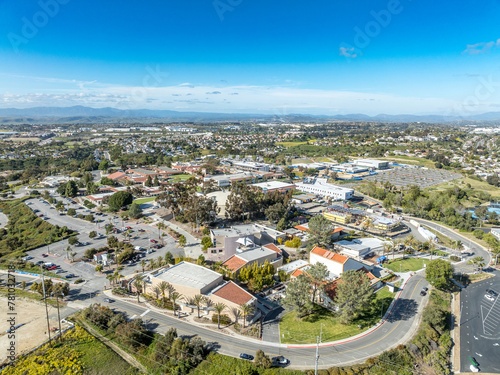 Fototapeta Naklejka Na Ścianę i Meble -  Aerial view of Miracosta public community college serving coastal North San Diego County in Oceanside California with parking lot for students
