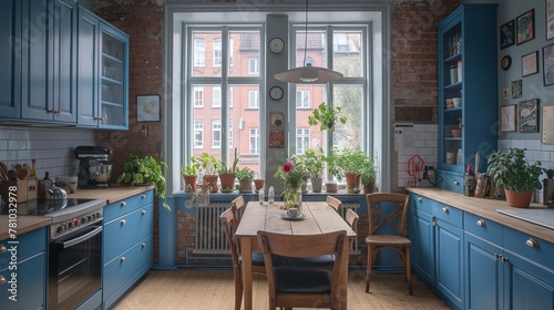 Interior design of a small compact kitchen in rich blue tones with wooden furniture and a window