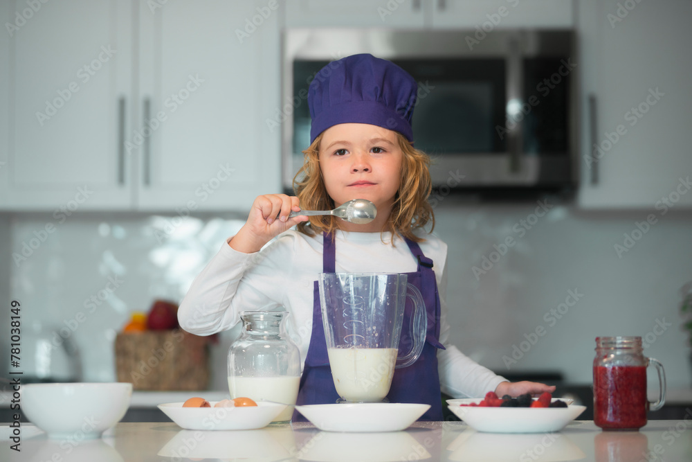 Chef child cooking healthy meal and dinner preparation. Child making tasty delicious. little boy in chef hat and an apron cooking in the kitchen. Chef child cooking healthy meal and dinner preparation. Child making tasty delicious. little boy in chef hat and an apron cooking in the kitchen.