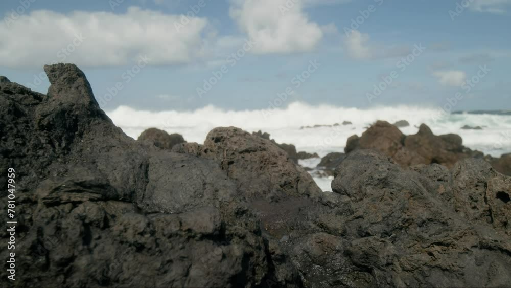 Slowmotion sharp volcanic rocks foreground, crushing ocean waves near Punta Negra, Buenavista del Norte, Tenerife, Canary Islands in spring Slowmotion sharp volcanic rocks foreground, crushing ocean waves near Punta Negra, Buenavista del Norte, Tenerife, Canary Islands in spring