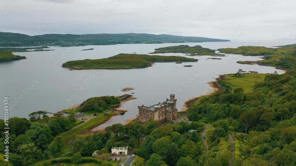 Drone Shot of Scottish Castle. Isle of Skye, Scottish Highlands, Scotland, United Kingdom. Drone Shot of Scottish Castle. Isle of Skye, Scottish Highlands, Scotland, United Kingdom.