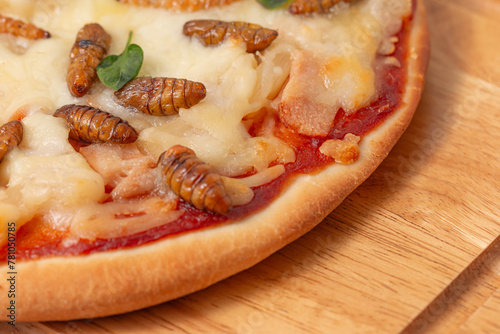 Pizza with silkworm pupae and mozzarella, edible insects in Thailand. Close-up