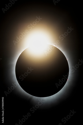 The last light from the sun peaks out before it is completely covered by the moon during the total solar eclipse on April 4, 2024. This look is called the diamond ring effect.
