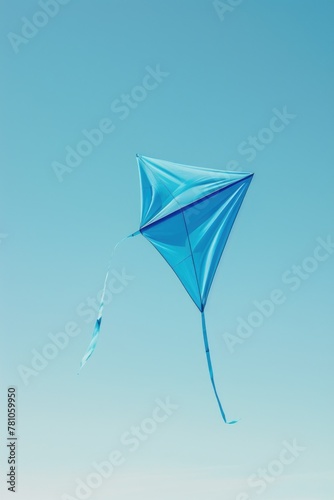 A blue kite soaring high in the sky  suitable for various outdoor activities promotions
