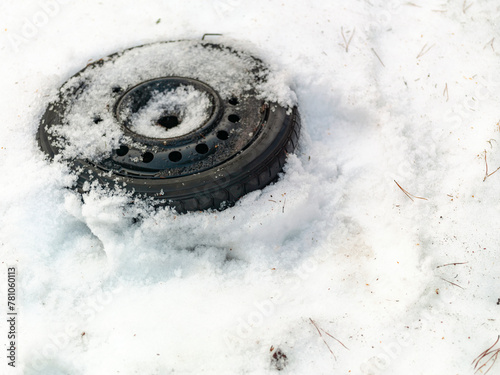 wheel abandoned in the snow