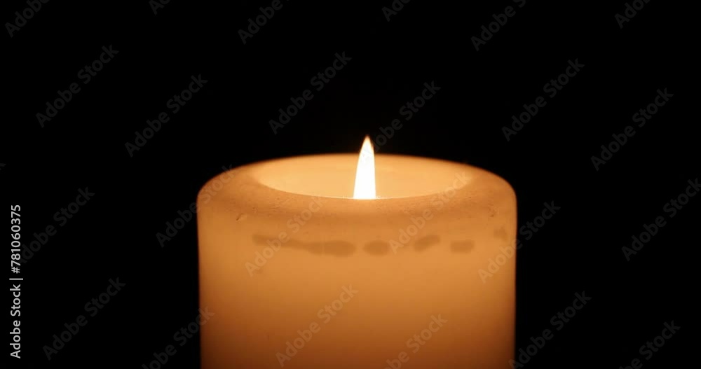 Hands being warmed by a candle flame Hands being warmed by a candle flame