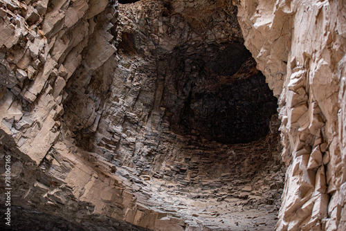 A cave formed in bedrock with a central hole caused by erosion. Ashabi-Kahf in Nakhchivan. photo