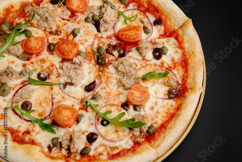 Delicious Pizza with Tuna, Tomatoes, Mozzarella Cheese, and Olives on Black Background