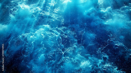 The image is of a body of water with a blue color. The water appears to be moving and has a lot of bubbles. Scene is calm and peaceful, as the water seems to be still and serene