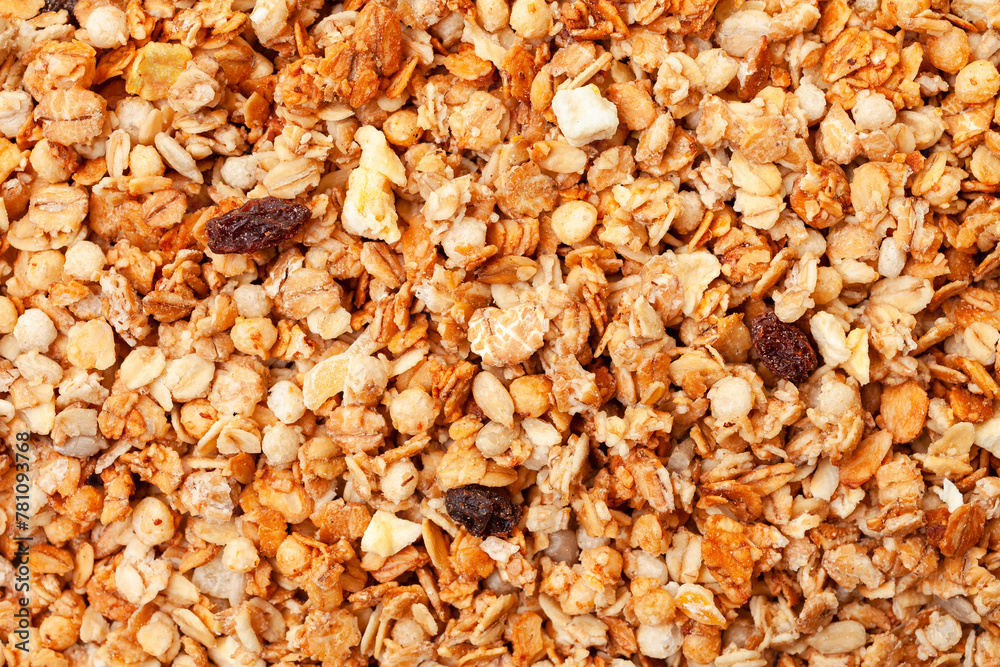Muesli oat cereals with raisins, dried fruits and sunflower seeds background. Top view Muesli oat cereals with raisins, dried fruits and sunflower seeds background. Top view