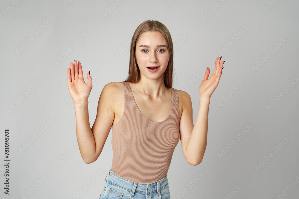 Clueless Young Woman Holding Out Her Hands Gesturing She Doesn't Know Clueless Young Woman Holding Out Her Hands Gesturing She Doesn't Know