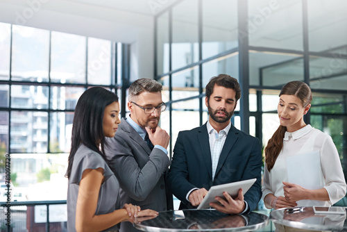 Discussion, people and meeting in office with tablet for business report or online growth with information sharing. Manager, employees and digital tech for review, corporate and careers in sales.