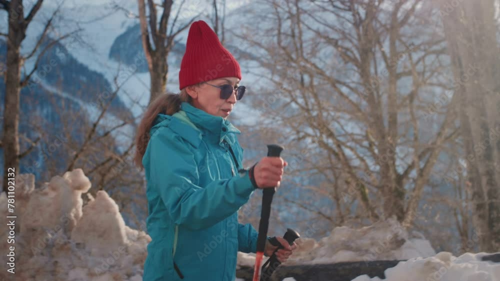 custom made wallpaper toronto digitalOld gray-haired woman hiking in the winter mountains. The senior female uses sticks for Nordic walking. Hiking to the Snowy peaks in the national Park. Elderly Granny's Face, hiking. Active lifestyle