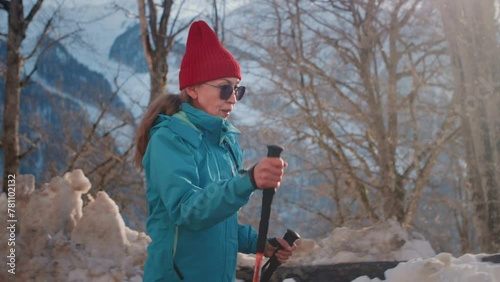 Wallpaper Mural Old gray-haired woman hiking in the winter mountains. The senior female uses sticks for Nordic walking. Hiking to the Snowy peaks in the national Park. Elderly Granny's Face, hiking. Active lifestyle Torontodigital.ca