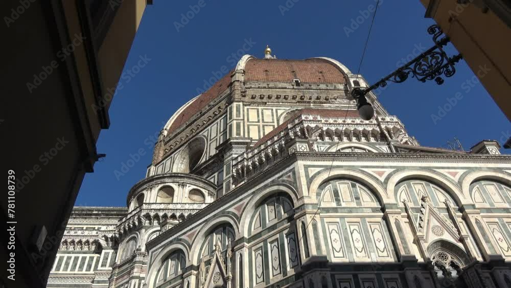 Florence, Italy, seen from below. Details of the cathedral and Giotto's bell tower. View of the Basilica of Santa Maria del Fiore. 4K footage