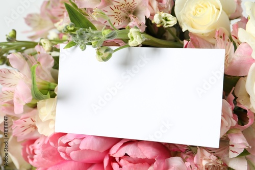 Happy Mother's Day. Beautiful flowers with blank card on light background, closeup © New Africa